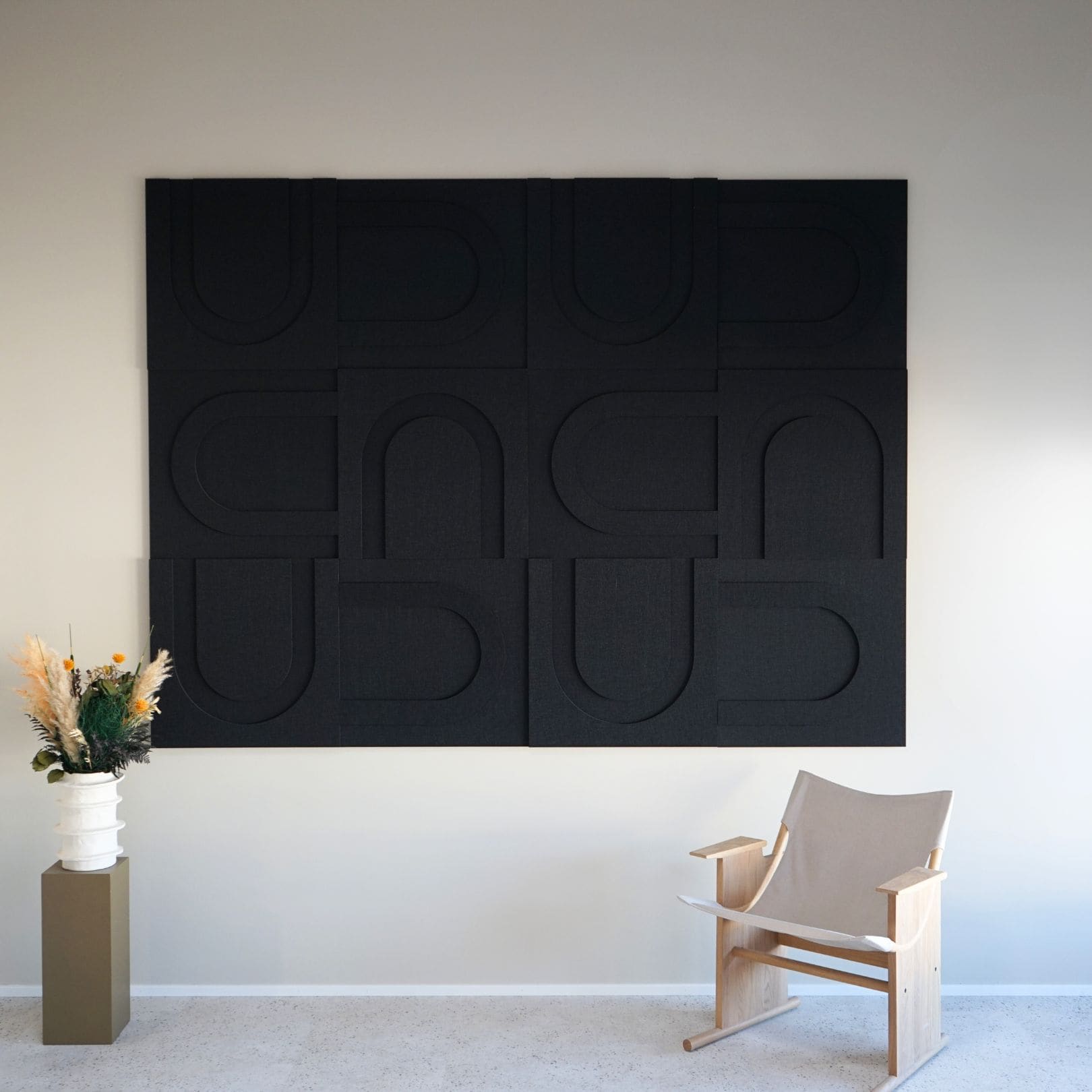 Large black geometric wall art panels from Arturel, designed for sound absorption and minimalist interior decor.